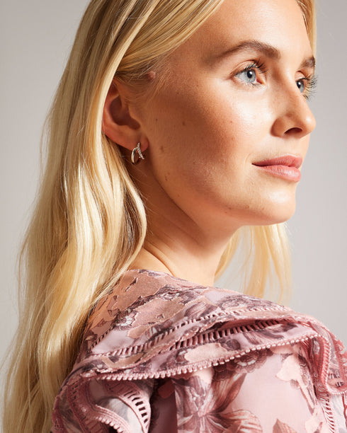 HELIAS-Jewellery-Need A New Go-to Piece? Meet Helias Our Dazzling Double Huggie Hoop Earrings. These Statement Earrings Feature A Striking Contrasting Texture With One Hoop Adorned With Shimmering Crystals For An Extra Touch Of Glamour. Double huggie hoop earrings Contrasting texture One crystal embellished hoop Engraved logo Stud back Comes in Ted Baker branded gift box- Ted Baker Romania